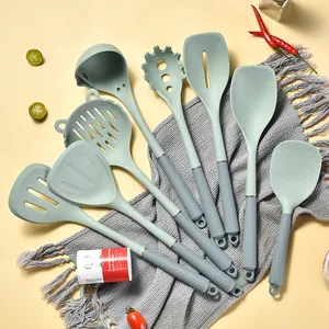 8-piece silicone kitchen utensil set with heat-resistant mint green heads and grey handles