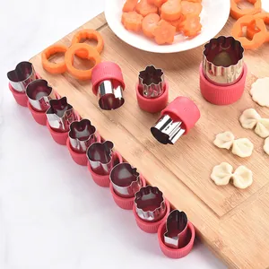 12-piece stainless steel vegetable and cookie cutter set with protective hand guards.