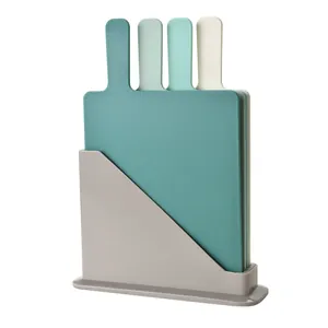 4-piece color-coded plastic cutting board set with racquet handles and storage stand