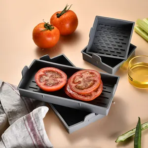 4-piece grey silicone baking pan set with ridged base for kitchen roasting.