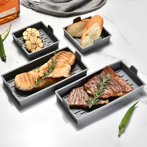 Four-piece grey heat-resistant silicone baking trays for oven and air fryer use