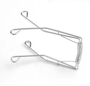 Detailed view of 304 stainless steel spring-loaded frying tongs for sausages and meat rolls