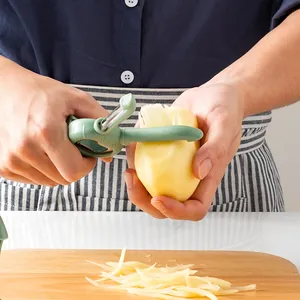 Multifunctional 4-in-1 kitchen peeler and bottle opener in use peeling a fresh potato