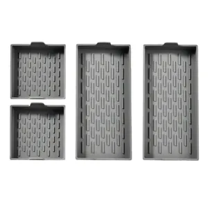 Set of four heat resistant grey silicone baking sheet pans for oven cooking and roasting