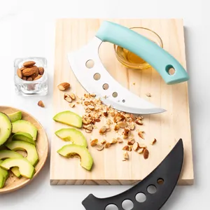 Stainless steel crescent chopper and pizza cutter with mint green handle on wood board