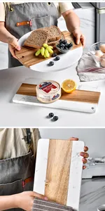 Detailed view of handcrafted marble and acacia wood serving board for steak and cheese
