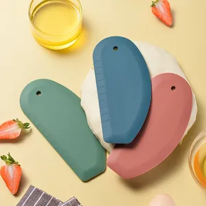 Set of three colorful silicone dough scrapers with precise scale for baking and pastry