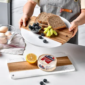 Elegant marble and acacia wood serving board for cheese and bread, perfect for afternoon tea