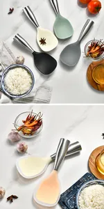 Detailed view of heat-resistant silicone rice paddles with stainless steel handles
