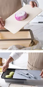 Close-up detail of the 2-piece folding drain basket and cutting board set in a kitchen.