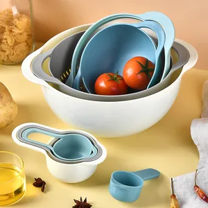 8-piece nesting kitchen bowl set with colander and measuring cups in blue and white