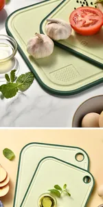 Detail of double-sided wheat straw cutting board with built-in garlic grinder and scale