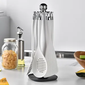 Premium 7-piece white silicone kitchen utensil set with a rotating storage stand holder