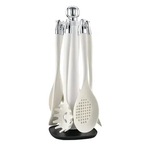 7-piece silicone kitchen utensil set with rotating storage stand in creamy white