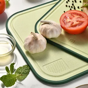 Eco-friendly wheat straw cutting board with non-slip edges and built-in garlic grinder