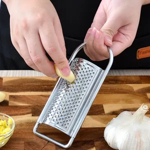 Professional stainless steel handheld grater for ginger garlic and lemon zest for kitchen use