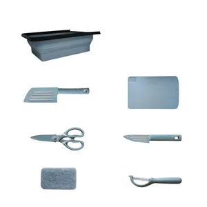 Gray collapsible kitchen tool set including cutting board, knives, and drain basket