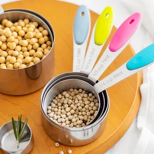 Stainless steel measuring cups set with colorful silicone handles for kitchen baking