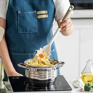 Professional silicone pasta server from heat-resistant kitchen utensil set in action
