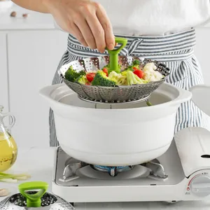 Panier vapeur pliable en acier inoxydable pour légumes et fruits de mer dans un pot