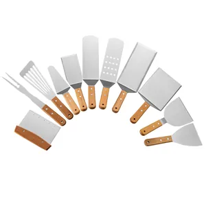 Professional 11-piece griddle accessory kit with wooden handles and stainless steel spatulas