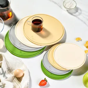 Multi-colored circular silicone heat-resistant mats for kitchen and dining tables