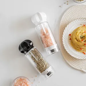 Clear acrylic manual salt and pepper grinder set with pumpkin-shaped top for kitchen spices