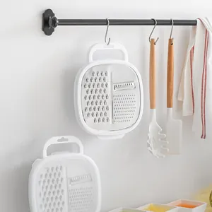 Multifunctional vegetable grater and slicer with container, perfect for kitchen meal prep
