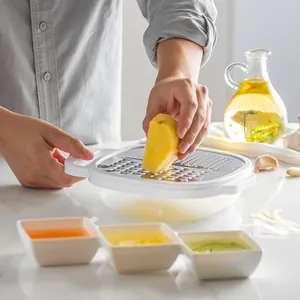 Multifunctional stainless steel vegetable grater with container used for shredding potato