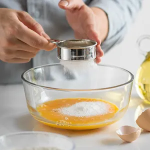 Stainless steel fine mesh flour sifter tool for baking and sifting powdered sugar.