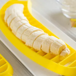 Bright yellow plastic banana slicer tool for quick and uniform fruit slicing in the kitchen