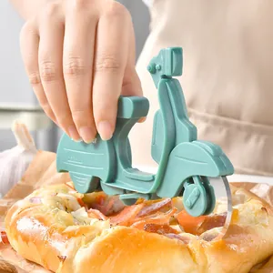 Retro mint green scooter-shaped stainless steel pizza cutter wheel for easy pizza slicing