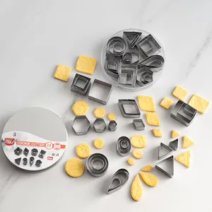 Complete 24-piece stainless steel geometric cookie cutter set with round metal storage tin box
