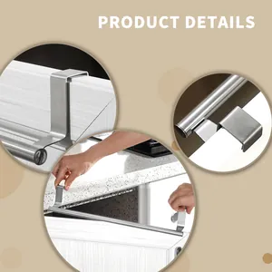 Detail view of stainless steel over-cabinet towel rack installation on door.
