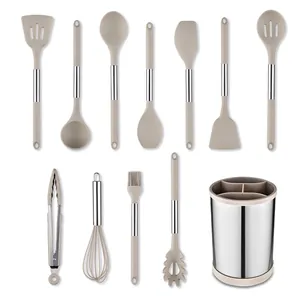 Twelve piece silicone kitchen utensil set with a rotating storage bucket in a beige finish