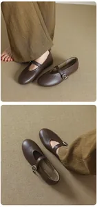 Detail view of stylish retro brown Mary Jane flats featuring round toe and buckle strap