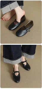 Detail view of black round-toe Mary Jane ballet flats featuring a vintage buckle strap