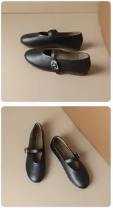 Detailed view of black round-toe Mary Jane flats with adjustable buckle straps