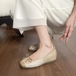 Eleganti ballerine stile francese color champagne con fiocco e suola morbida donna