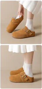Detailed view of warm brown suede fleece-lined clogs with a sturdy adjustable buckle strap