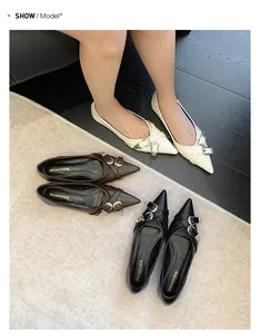 Detail view showing black, brown, and cream pointed-toe flats with metal buckles