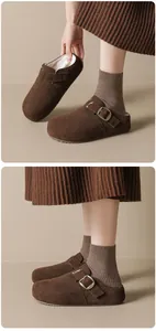 Detailed side view of brown suede fur-lined clog slippers with stylish metal buckle