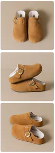Detail view of camel suede platform clogs with cozy fleece lining and buckle strap