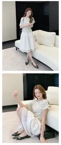 Elegant French style black pointed-toe flat shoes with metal buckle in lifestyle setting.