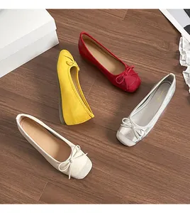 Detailed view of elegant French style ballet flats with bows in four soft colors