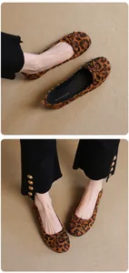 Close-up detail of leopard print ballet flats with dainty bow and soft comfortable flat sole