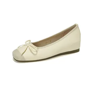 Elegant cream ballet flats with delicate bow detail and hidden inner heightening sole
