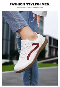 Stylish men's casual white leather sneakers GAT style with red stripes side view