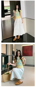 Elegant lifestyle view of an Asian model wearing tan suede buckle mules and a skirt.