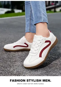 Stylish white men's casual leather sneakers with red side stripe and brown gum sole